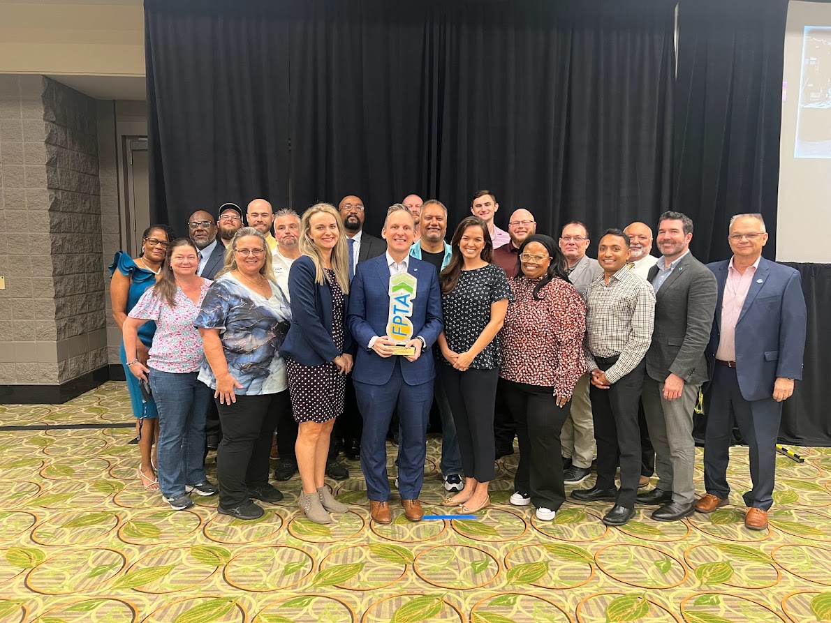 PSTA leaders and employees standing proudly with the FPTA System of the Year award