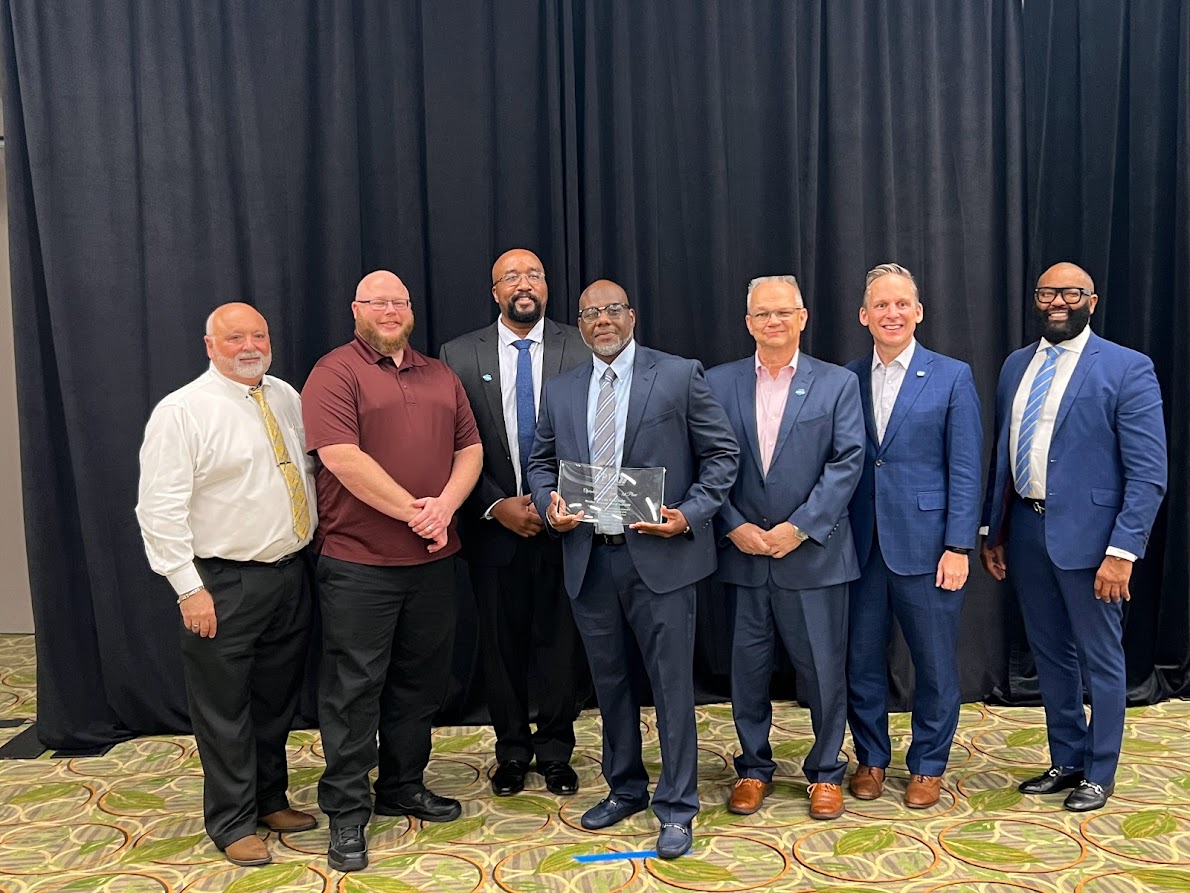 PSTA bus operator Marcus Kincade holding his award for 1st place Operator of the Year with other leaders